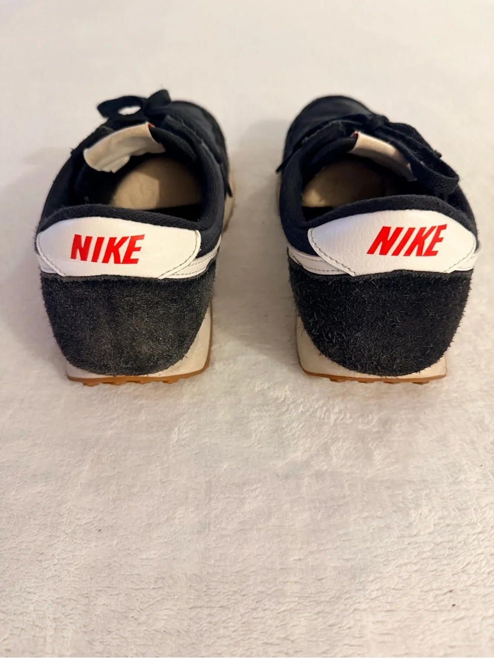 Nike Women’s Black Sneakers with White and Orange Accents
